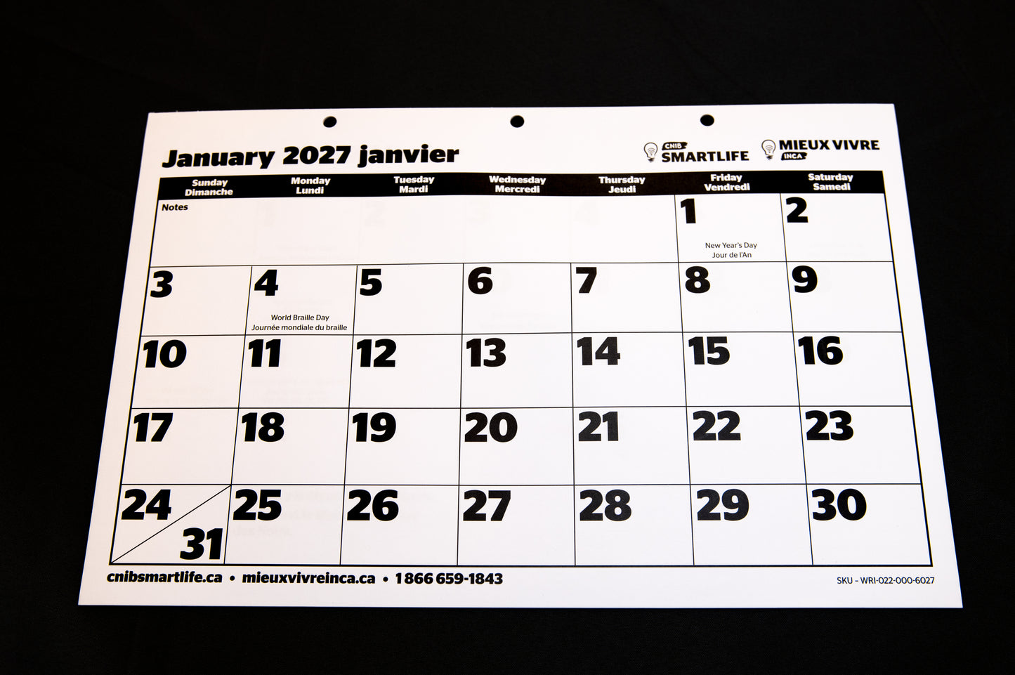 A 2027 CNIB SmartLife Calendar in French and English, photographed against a black background.