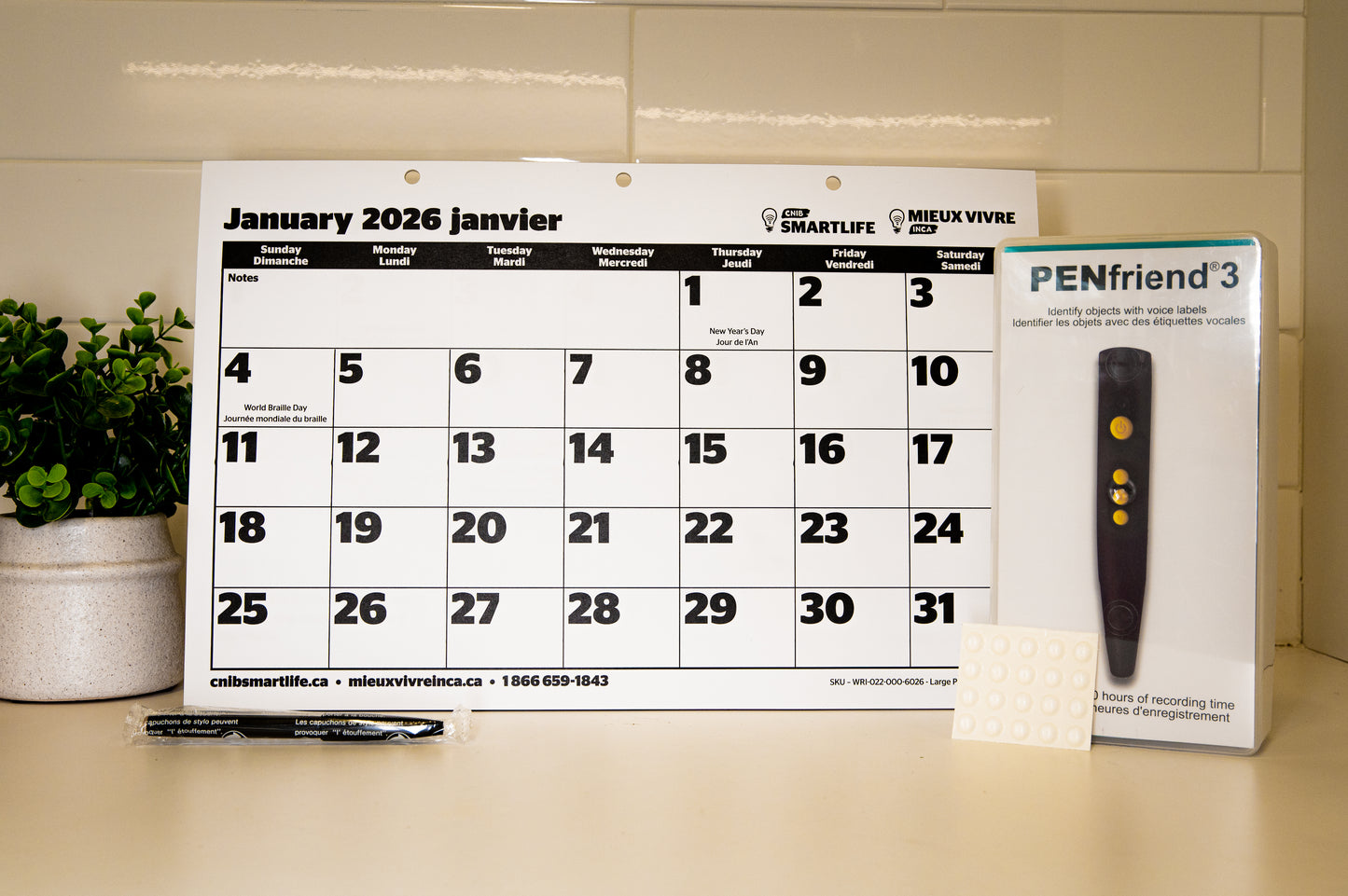 202l Large print calendar, clear bump dots, CNIB Penfriend and pentel pen