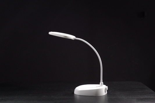 White LED desk lamp on a black background