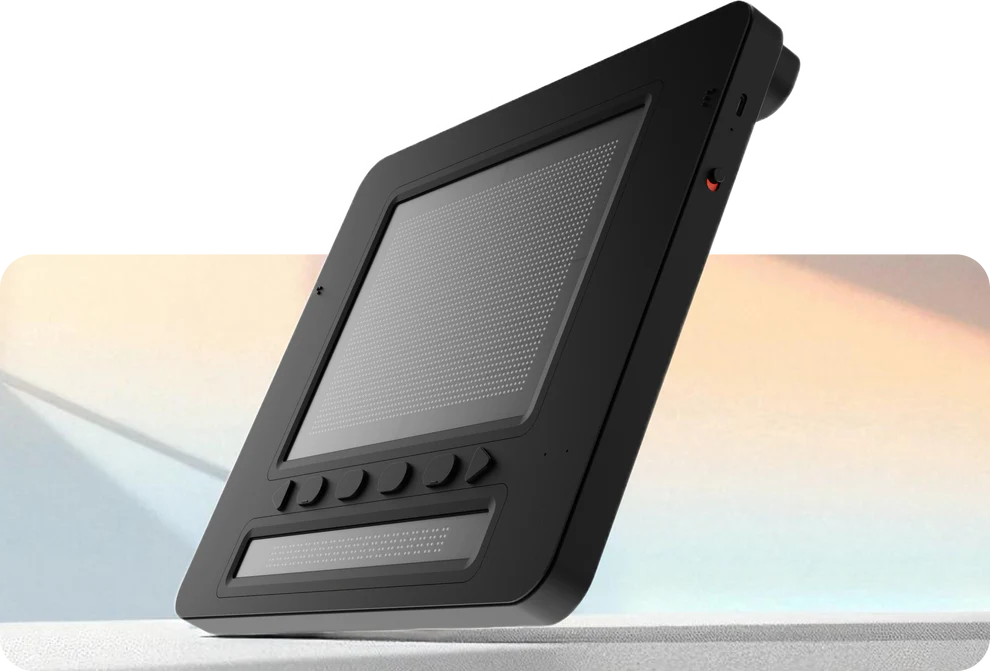 Angled view of Dot Pad X showing tactile display surface and side profile with power button and ports
