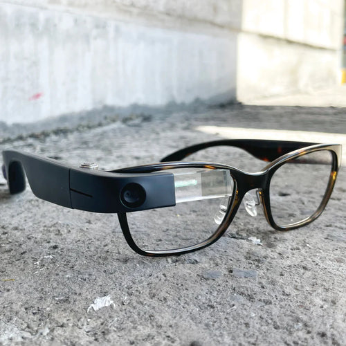 An image of the sleek Lux Sajama Tortoise Frames on a concrete surface.