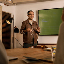 Load image into Gallery viewer, A presenter wearing the Envision Glasses giving a presentation