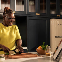 Load image into Gallery viewer, A woman cooking in the kitchen with the Envision Glasses on