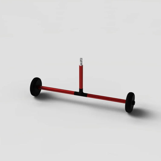 Red metal rod with black wheels on a light gray background