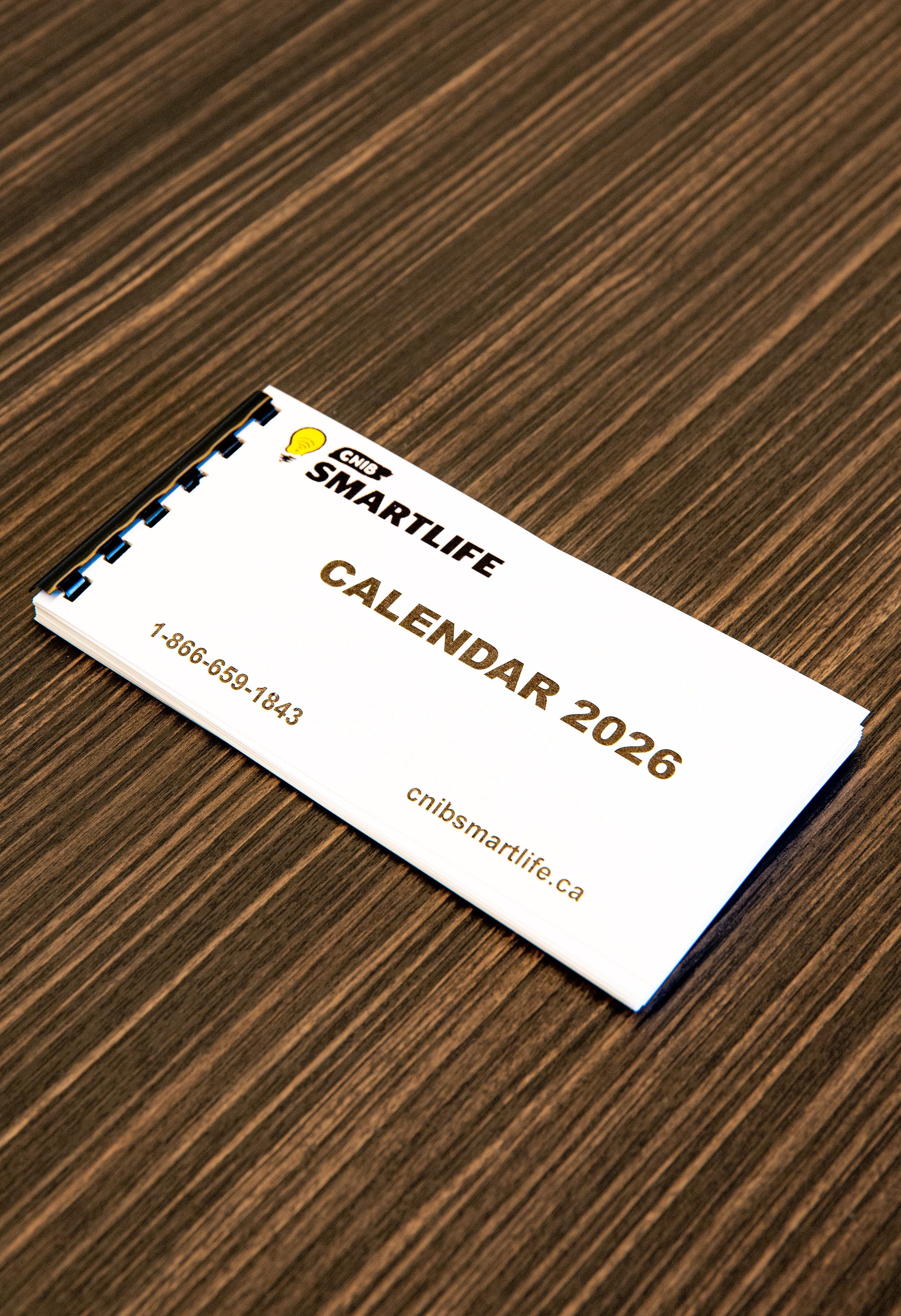 SmartLife 2026 calendar on a wooden surface