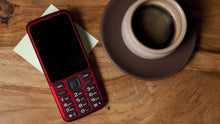 Load image into Gallery viewer, Red Blindshell Classic 1 Phone on a wooden table
