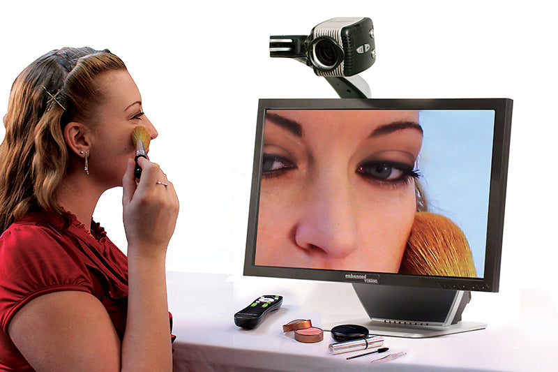 Picture of a woman using an Acrobat Ultra 24" CCTV to apply makeup