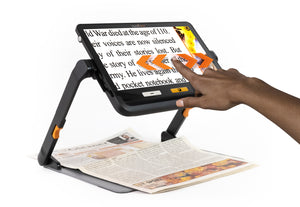 Explore 12 on Stand showing swiping functionality on screen with a magnified newspaper